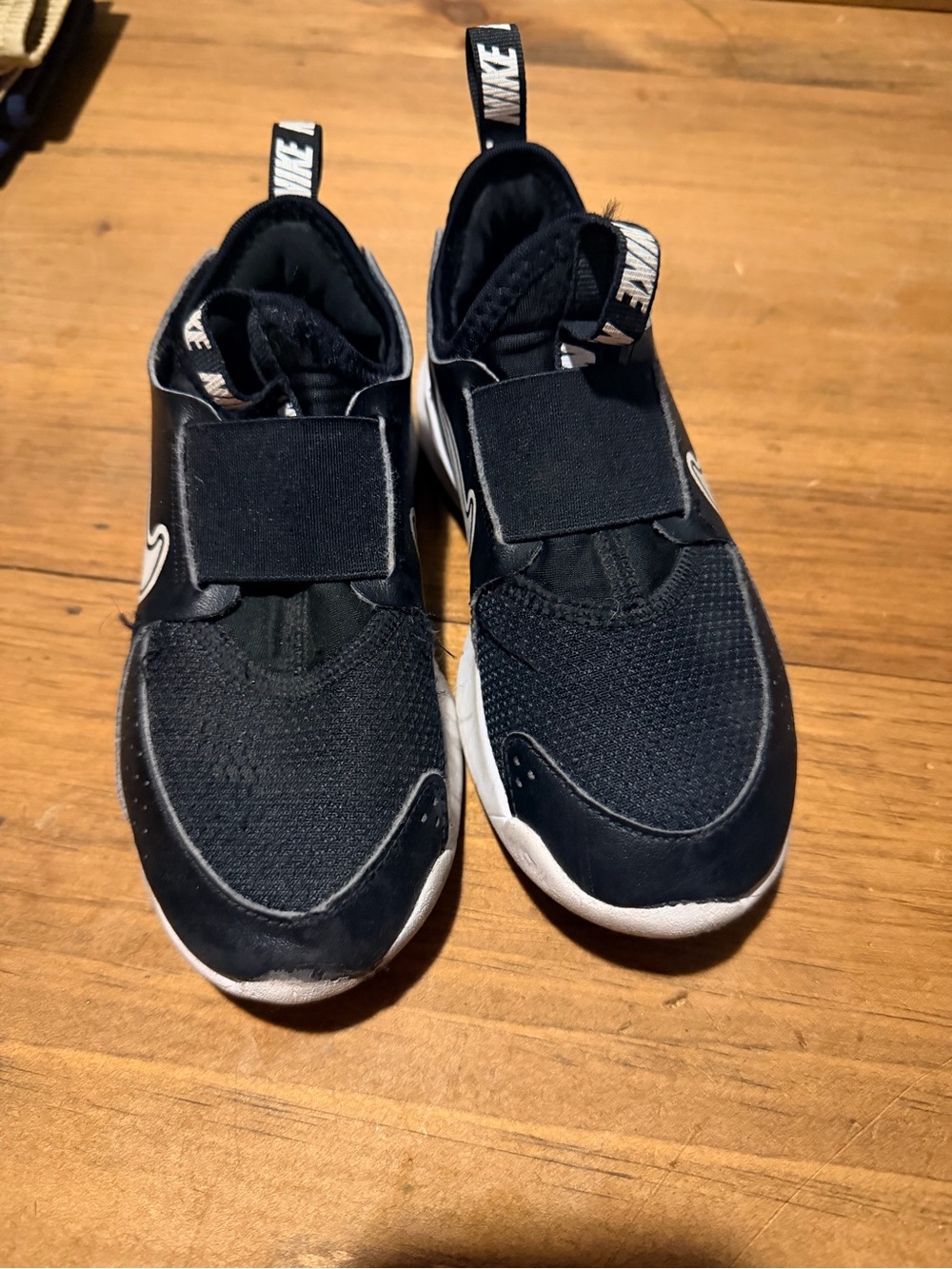 Nike Kids Black and White Slip-On Athletic Sneakers